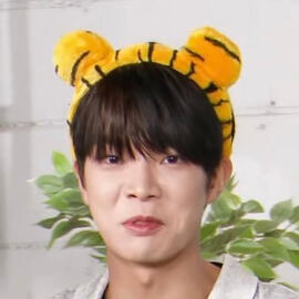 Lee Dongheon from Verivery wearing a tiger headband